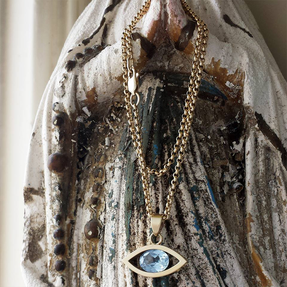 Handmade 9ct gold & blue topaz evil eye pendant, made to order by Lulu & Charles Jewellery